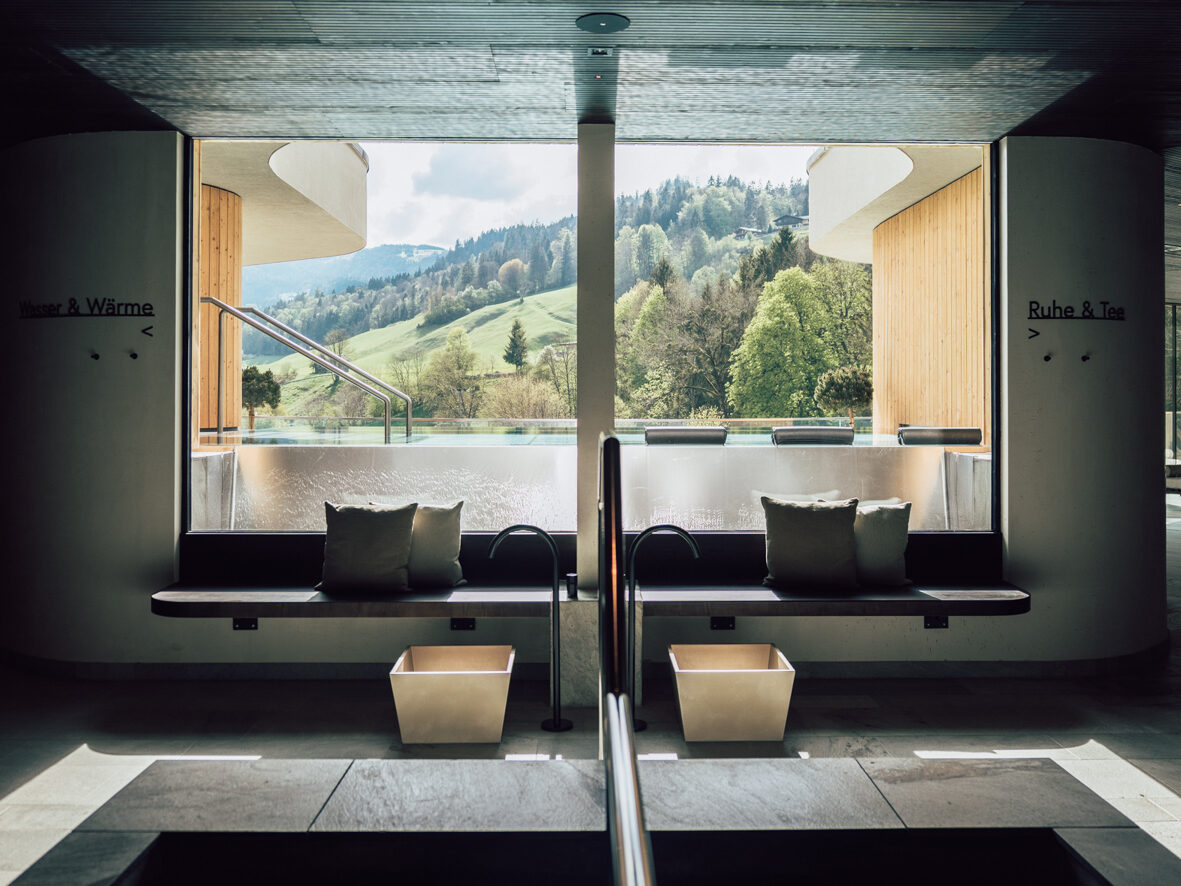 Rooftop adults-only spa at POST: low benches, oval skylights, an outlook onto the Salzachtal valley.
